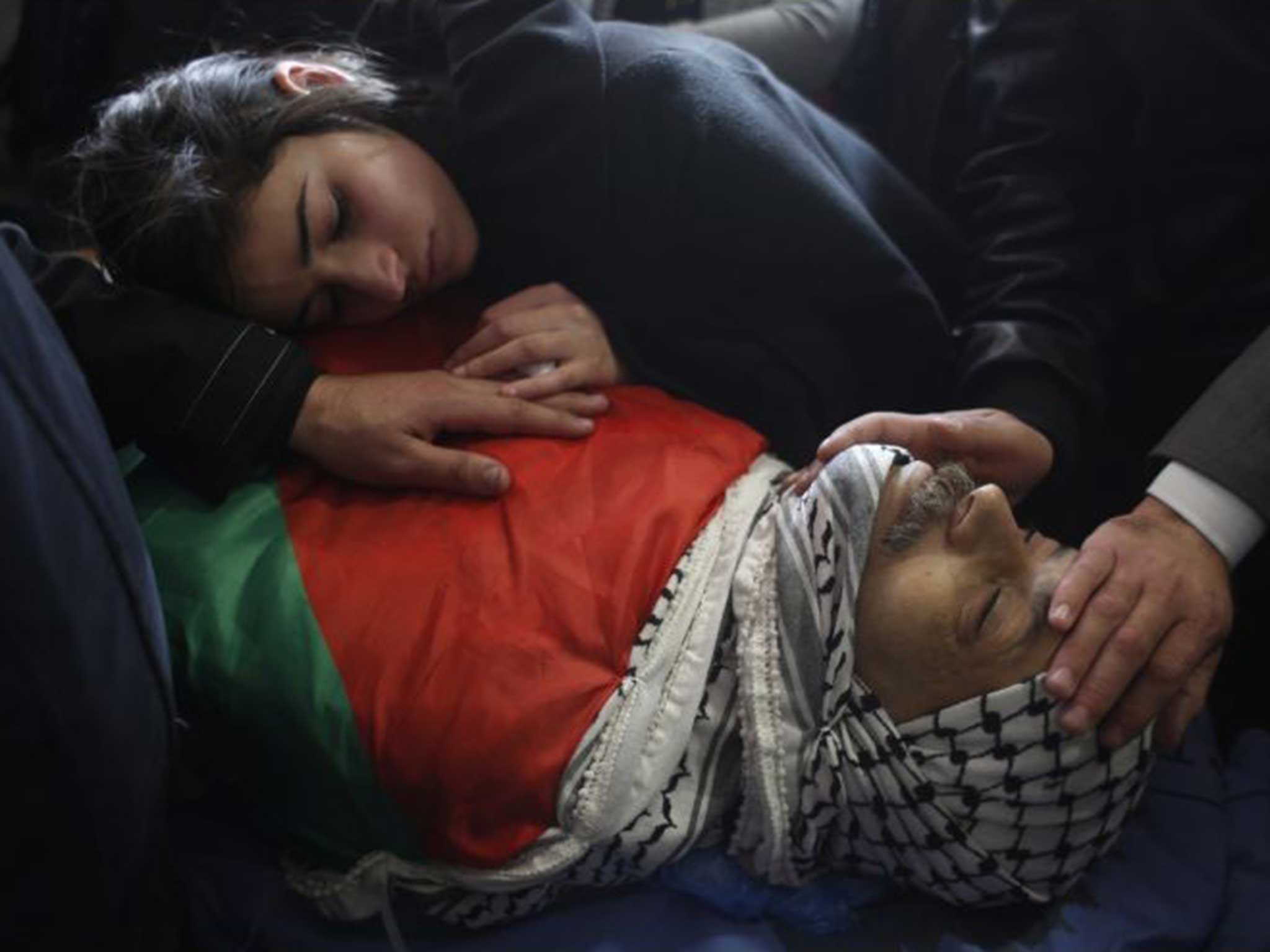 The daughter of killed Palestinian official Ziad Abu Ein bids her father goodbye
