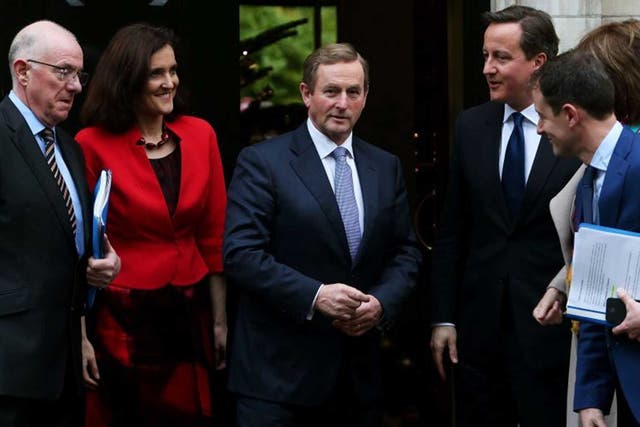 Prime Minister David Cameron and An Taoiseach Enda Kenny (centre) with (from left) Minister for Foreign Affairs Charlie Flanagan, Secretary of State Theresa Villiers, Sean Sherlock Minister of State at Department of Foreign Affairs, and Tanaiste Joan Burt
