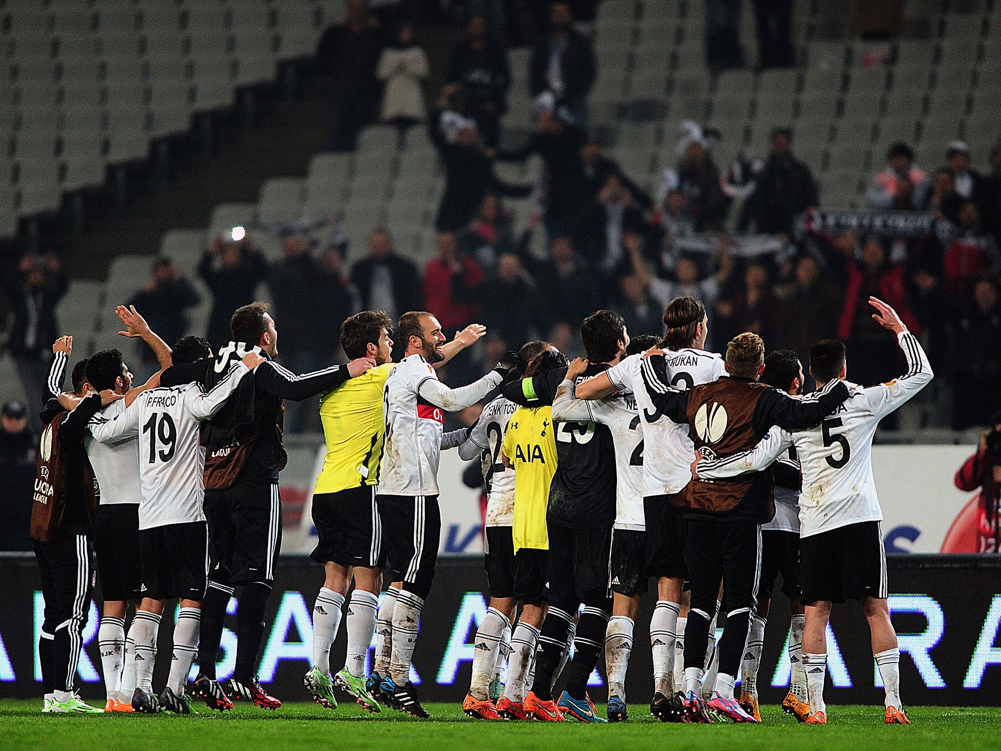 Besiktas players celebrate at the final whistle