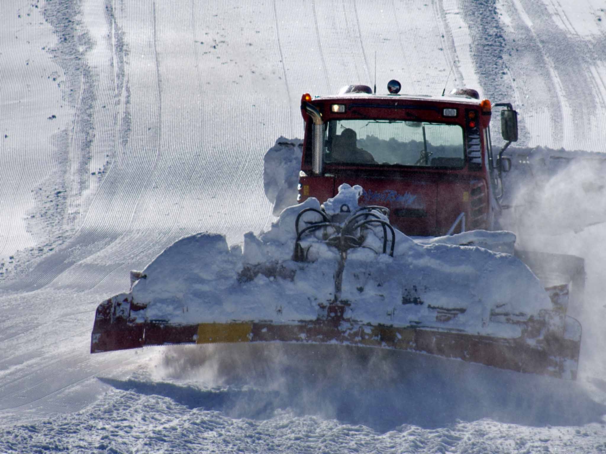 Snow go area: a piste-basher prepares the slopes before skiers arrive