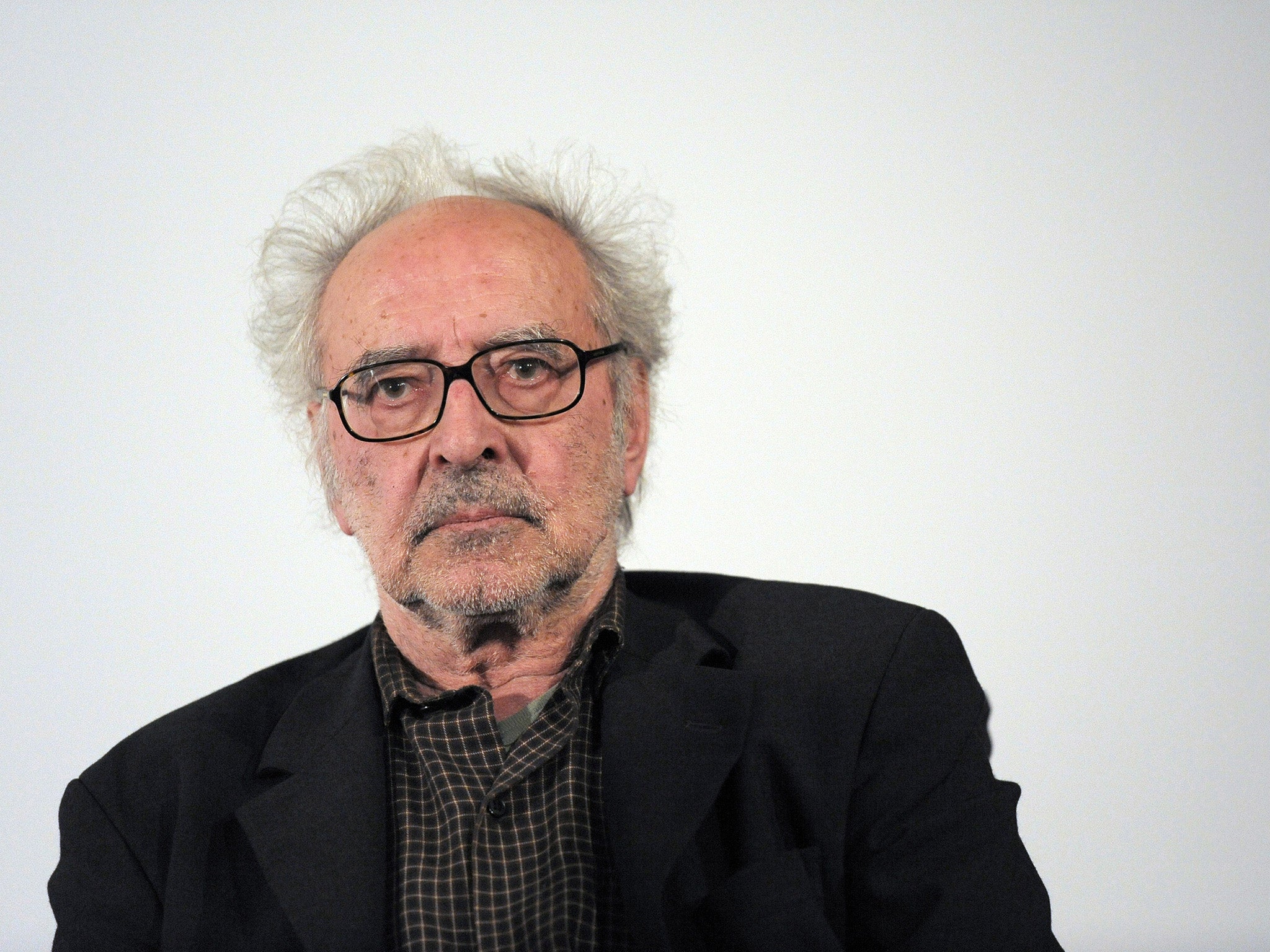 Swiss film director Jean-Luc Godard attends a debate as he presents his last movie 'Film socialiste' (Socialist movie) at the Cinema des cineastes in Paris
