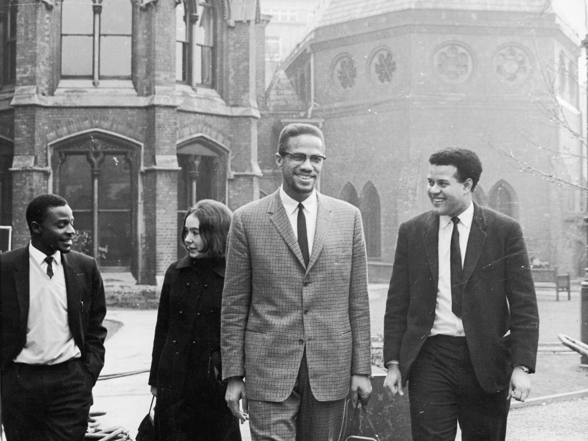 Black Nationalist leader and Nation of Islam spokesman Malcolm X in Oxford with Eric Abrahams, right, the Student Union president, before addressing university students on the subject of extremism in1964. (Photo by Keystone/Hulton Archive/Getty Images)