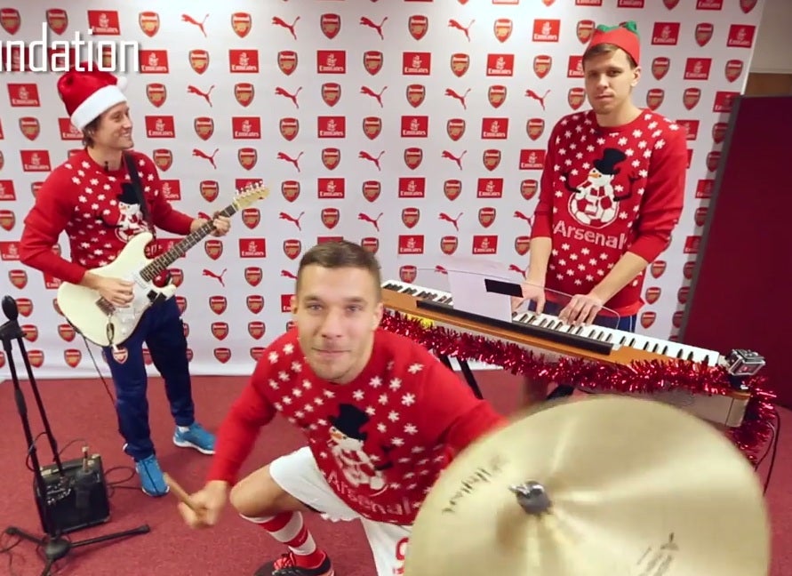 The Arsenal players in their Christmas band