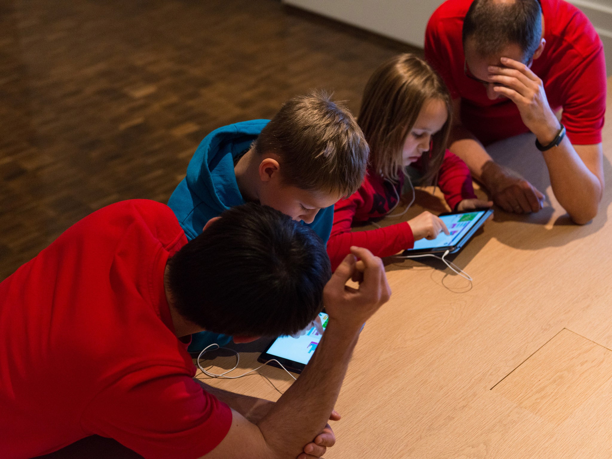 Children learn on iPads during an Hour of Code session at Apple Store Kurfürstendamm, in Berlin