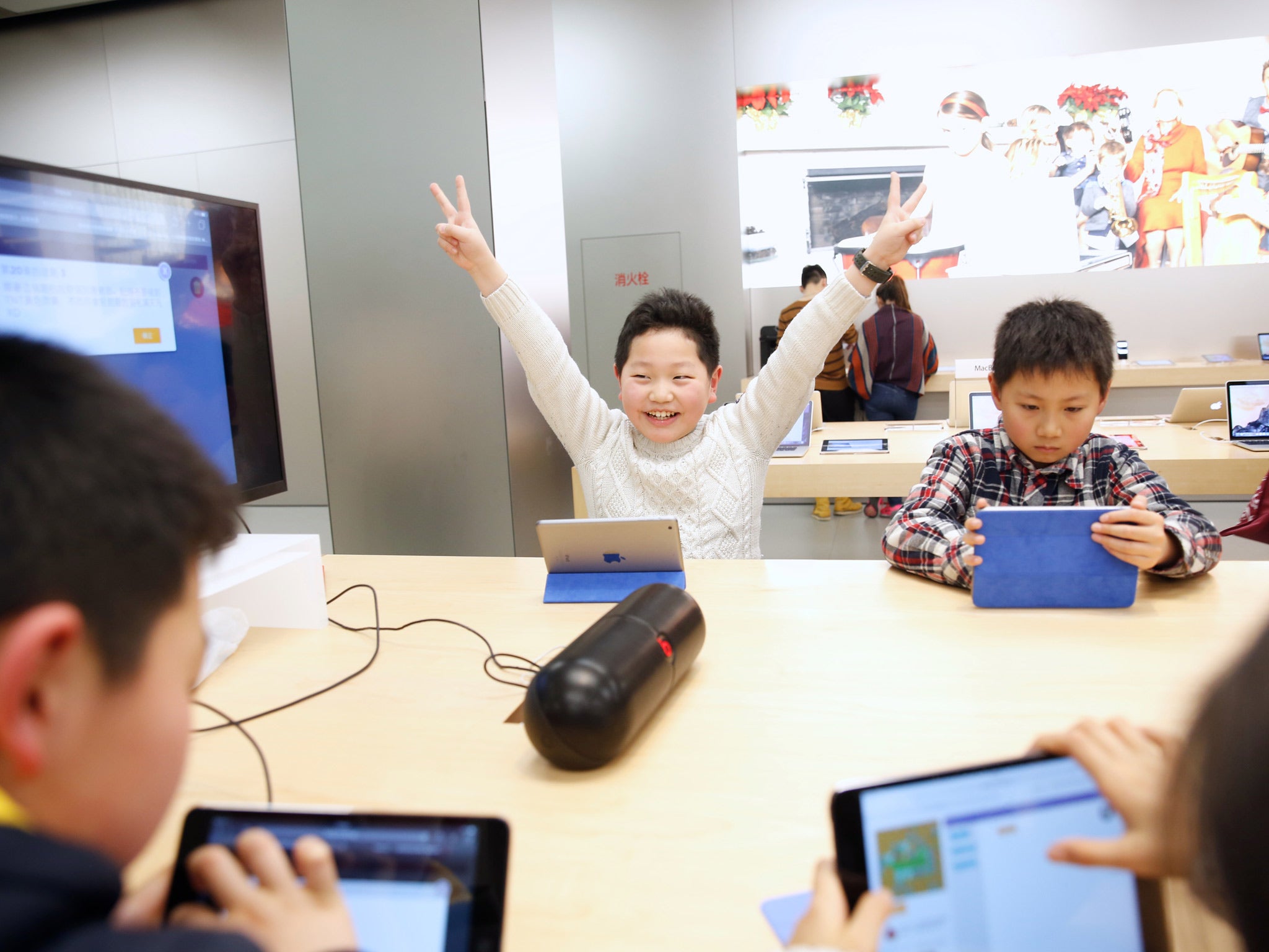 Children take part in Apple's Hour of Code training at the Apple Store iapm, in Shanghai