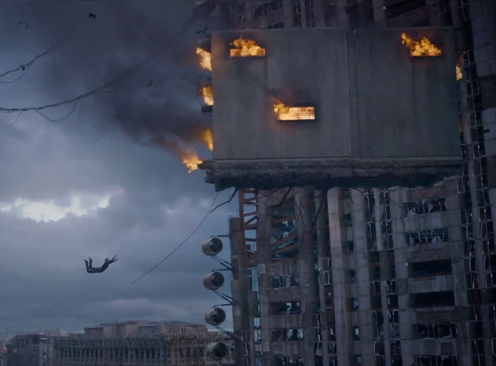 Tris jumps from a building in the new trailer for Insurgent