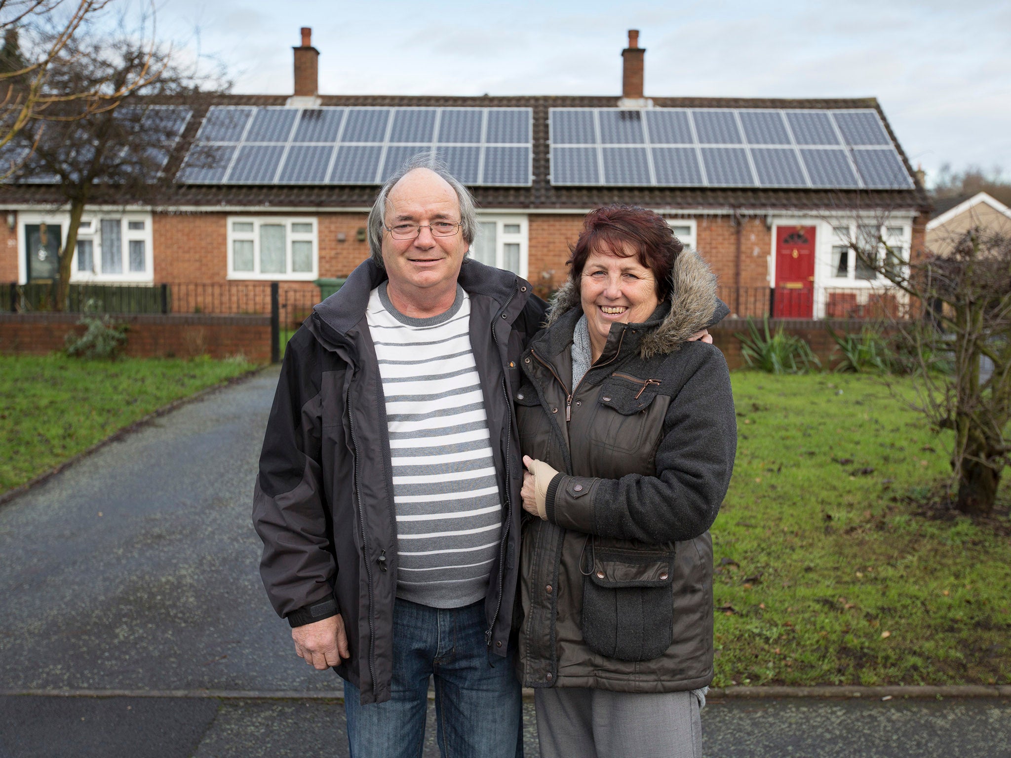 Pat and Richard Astbury at their home in Norton Canes, Staffordshire. They have benefitted from the Community Energy Project aimed at helping council tenants with their energy bills. They have had solar panels installed.