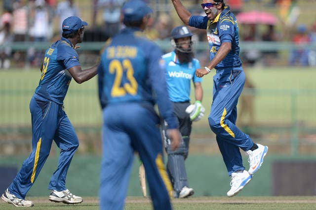 Sachithra Senanayke celebrates the wicket of Alastair Cook