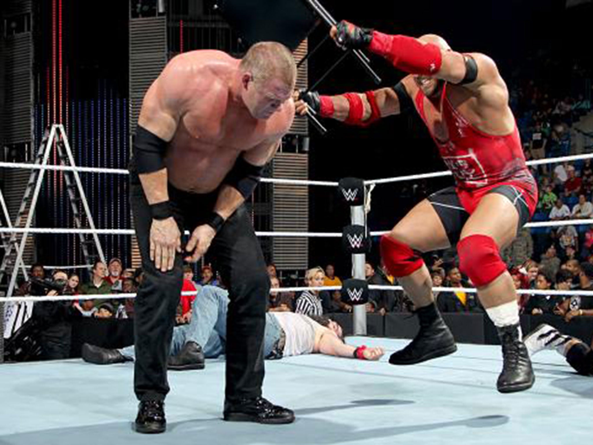 Ryback hits Kane with a chair