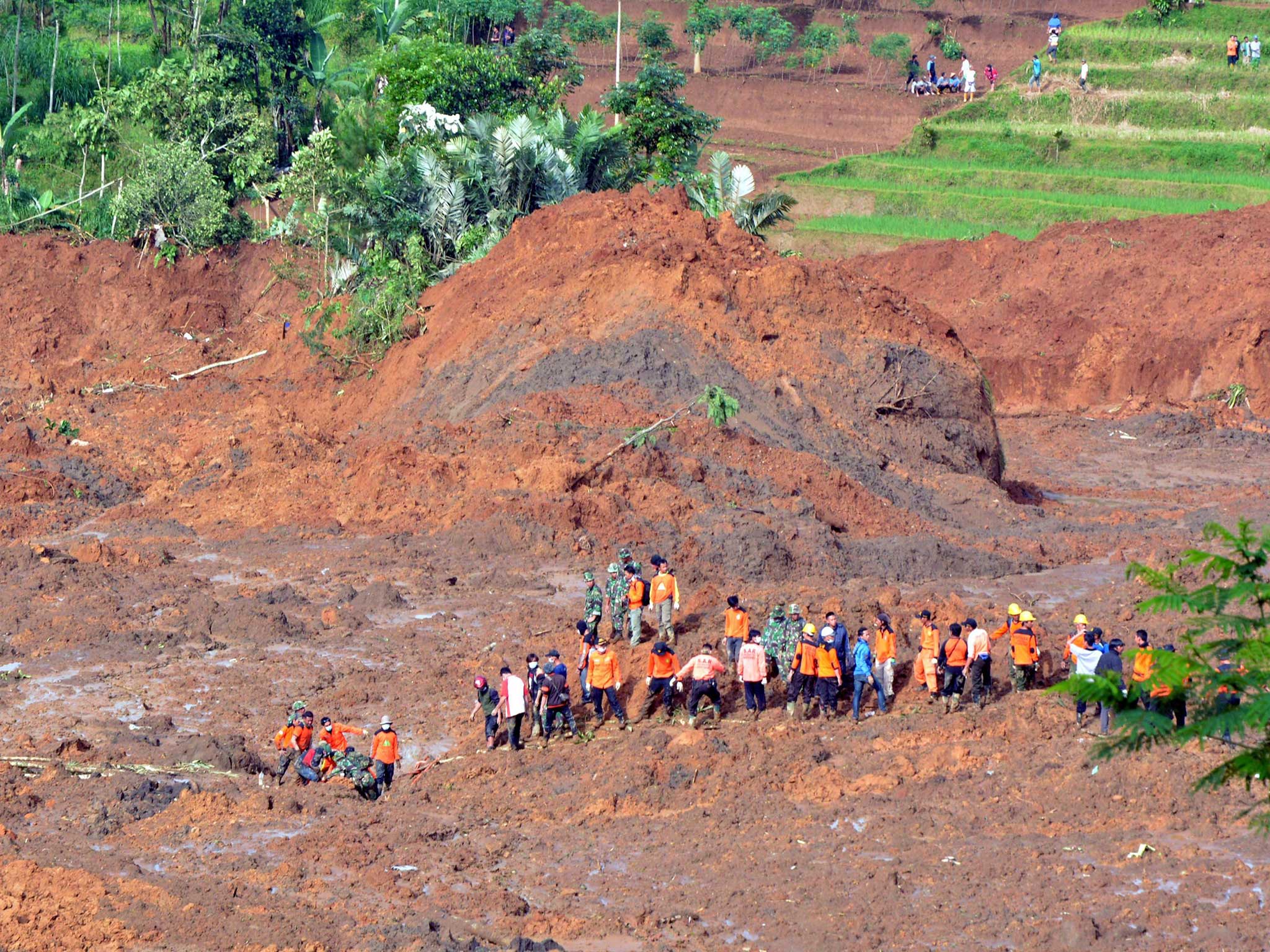 Rescuers survey the devastation