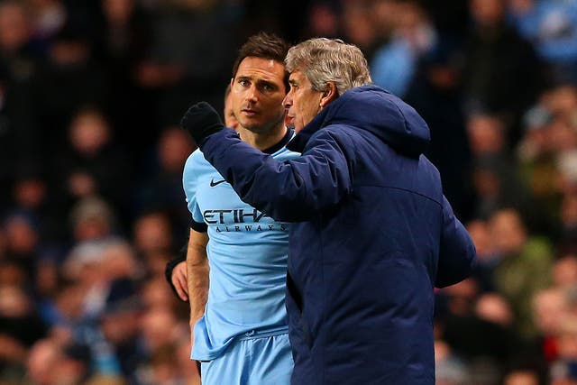 Manuel Pellegrini gives Frank Lampard instructions before bringing him on