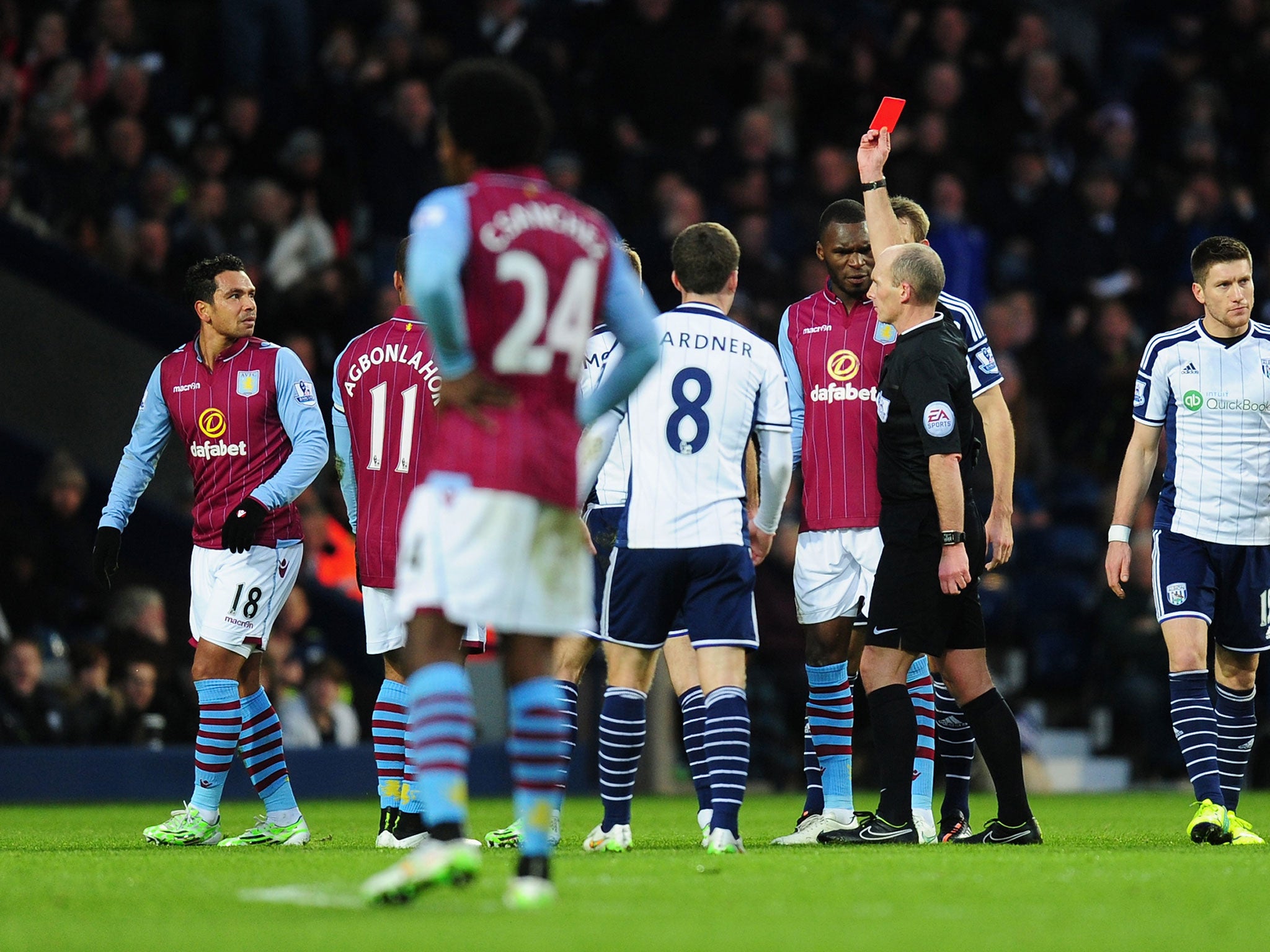 Kieran Richardson is shown a red card after a tackle on Stephane Sessegnon