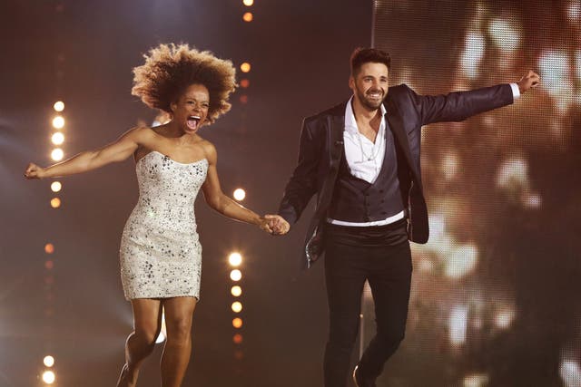 Fleur East and Ben Haenow jump for joy after hearing they have made it through to the live final