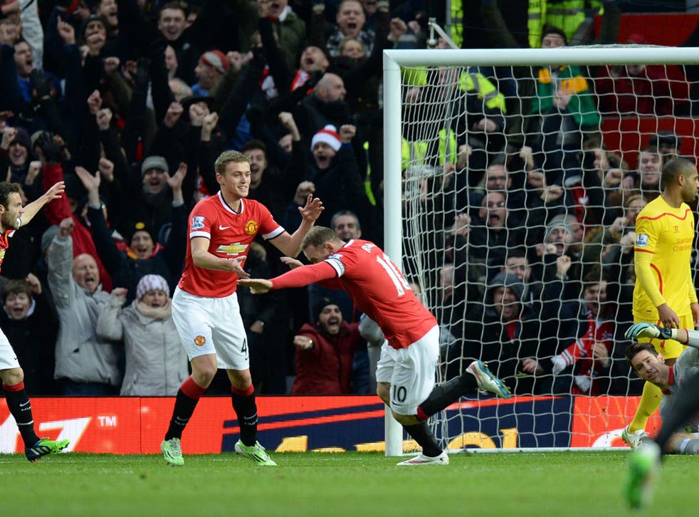 Wayne Rooney celebrates putting United 1-0 ahead
