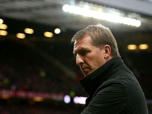 A downbeat Brendan Rodgers looks on as his side slip to defeat
