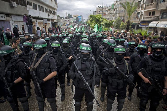 Hamas gunmen during a rally to commemorate the 27th anniversary of the militant group