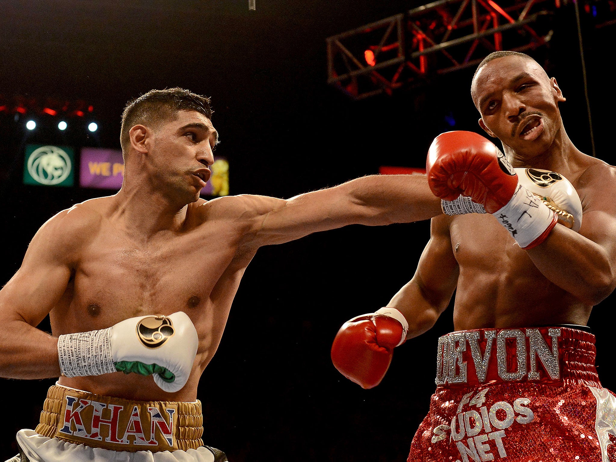 Amir Khan (left) takes apart Devon Alexander during his convincing victory at the MGM Grand in Las Vegas on Saturday