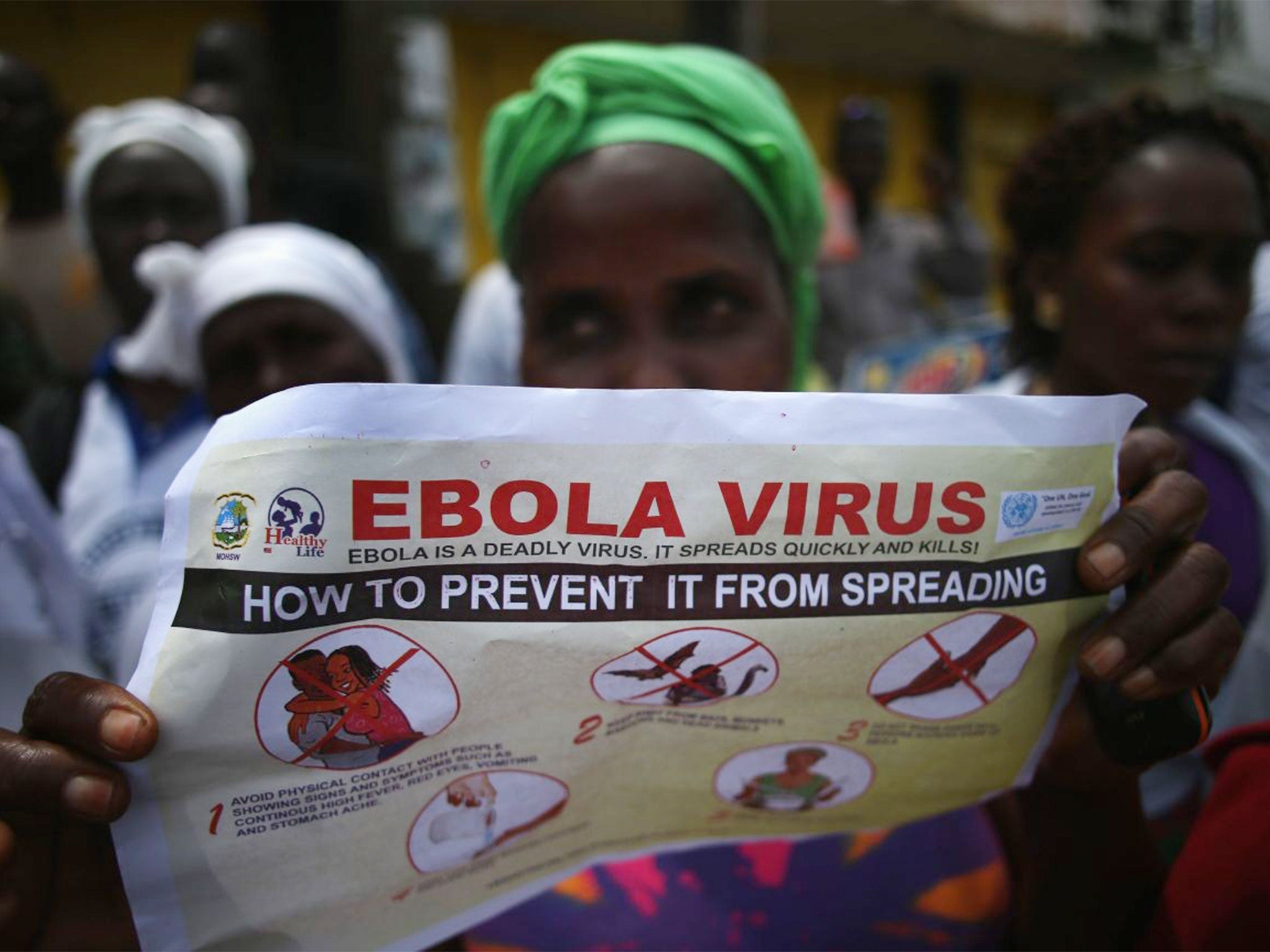 A public health advocate inviting people to an Ebola awareness and prevention event