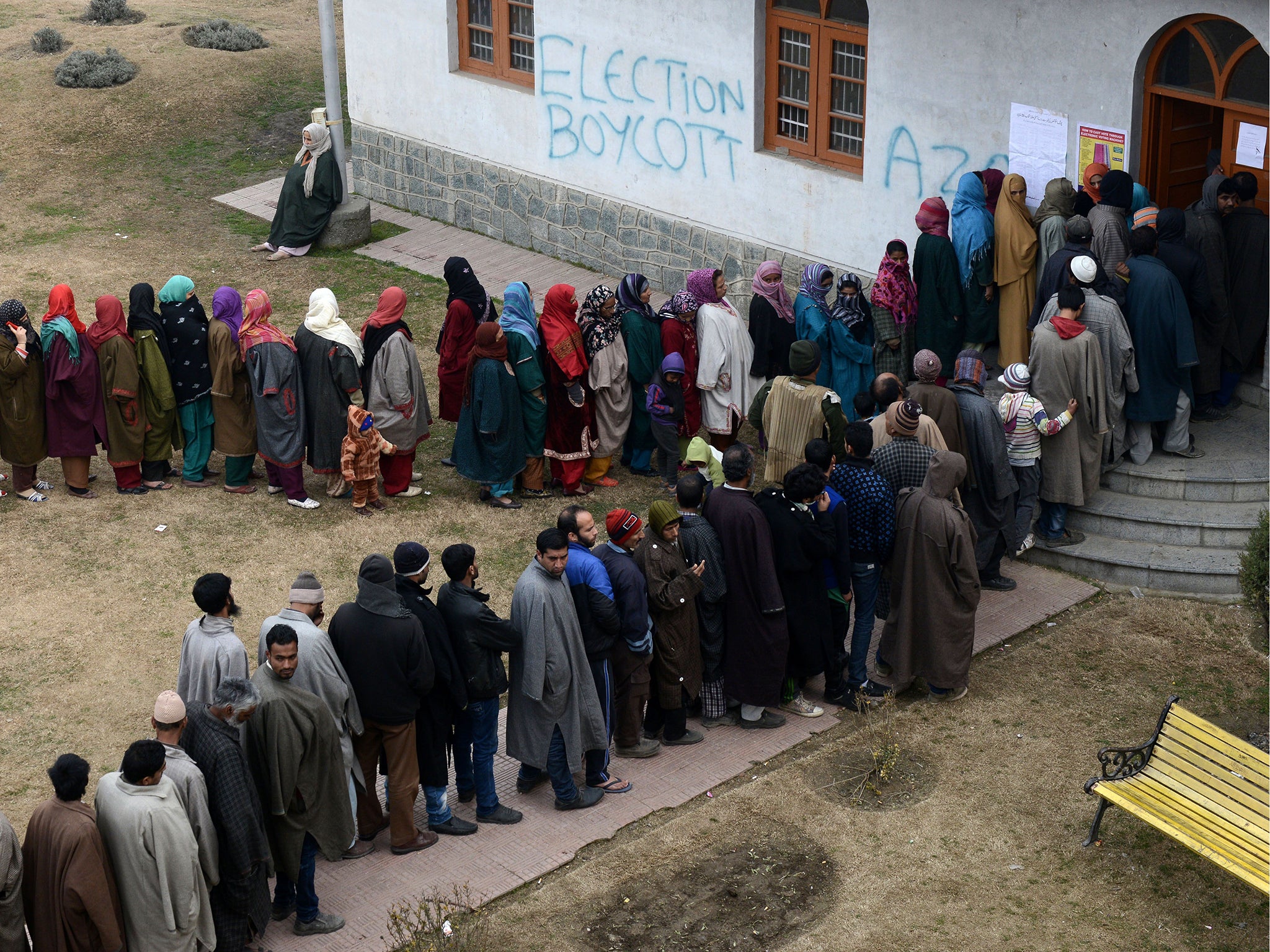 Grafitti calling for boycott of elections as Kashmiri voters queue in December