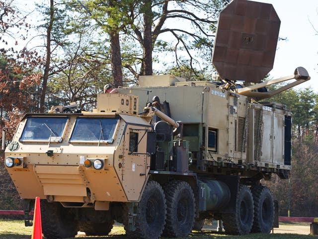 A US Marine Corps truck is seen carrying a palletized version of the Active Denial System in Quantico, Virginia. Officials have considered deploying the heat ray before at the US-Mexico border but it’s never been done before