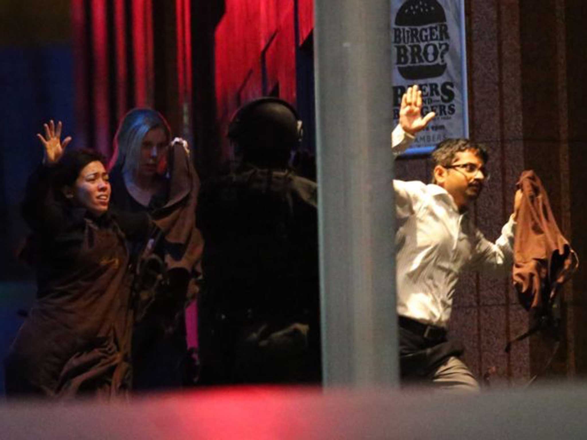 Hostages flee the building in Sydney
