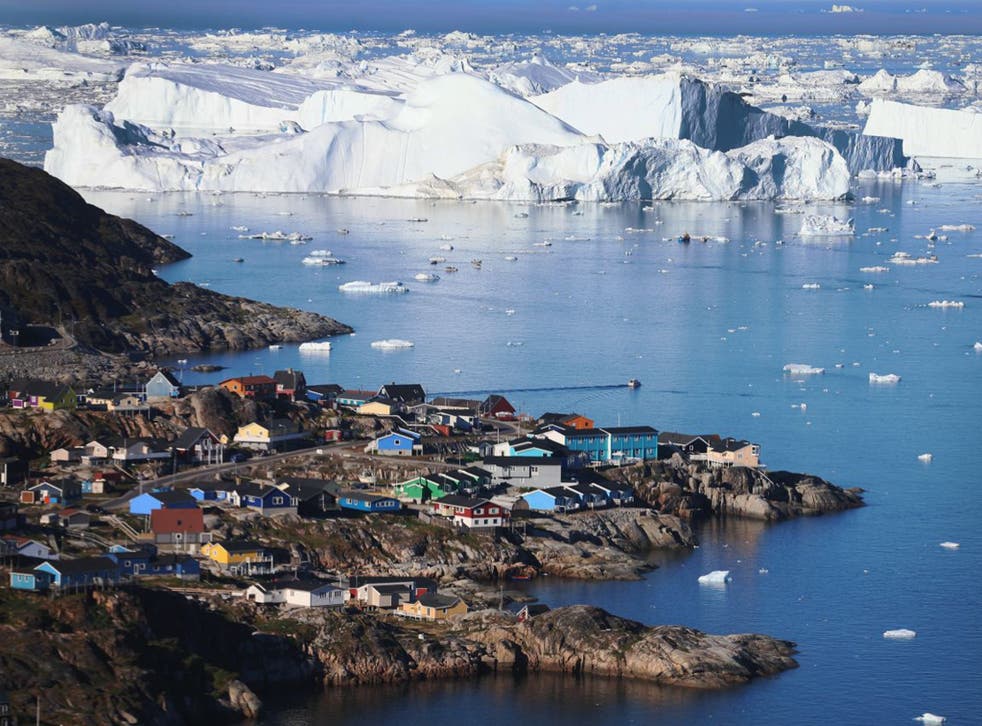 The village of Ilulissat seen near the icebergs that broke off from the Jakobshavn Glacier in July last year