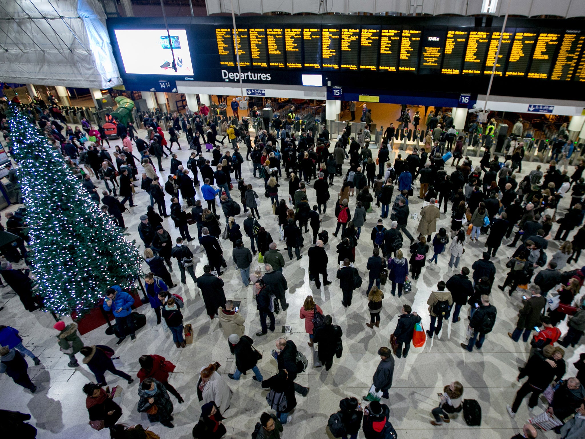 Travellers in front of the departure board at London Waterloo on December 23rd last year