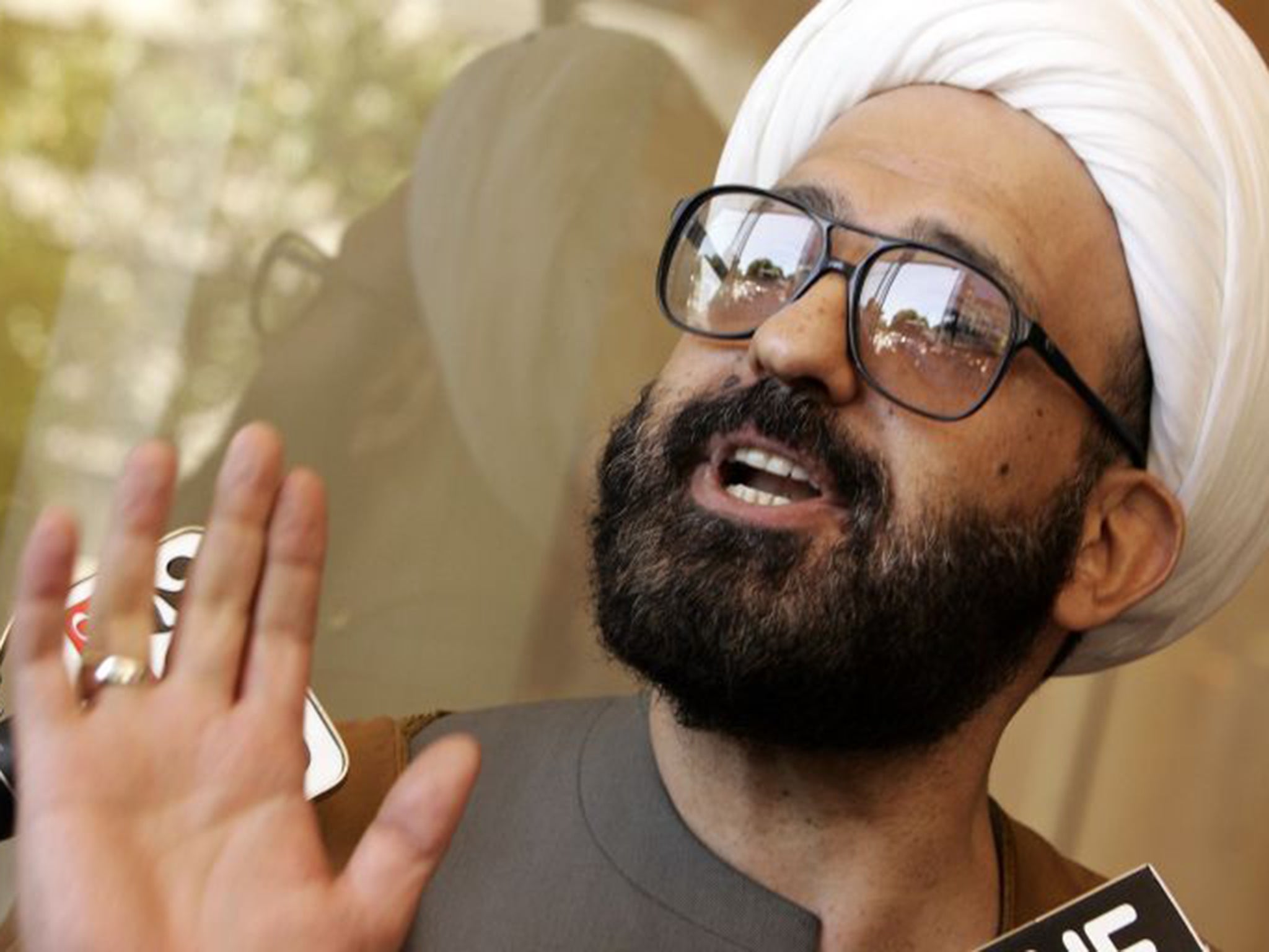 Man Haron Monis, also known as Sheik Haron, speaking to the media as he leaves local court in Sydney, 2009. Police say he operated from premises in Wentworthville, western Sydney, between 2000 and 2002