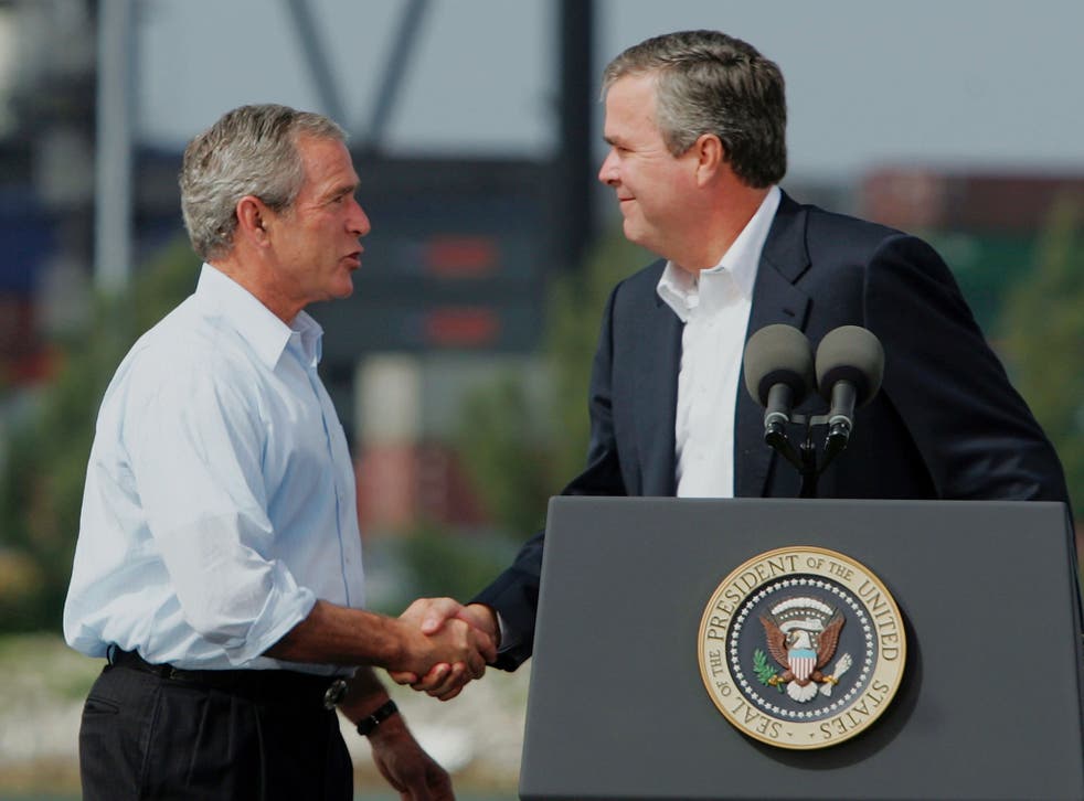 Jeb Bush (right) and his brother, President George W Bush (Getty)