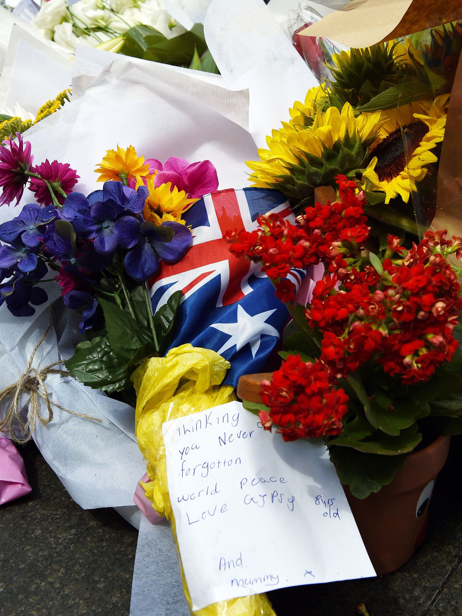 Flowers lay at a memorial near the Lindt chocolate cafe in Martin Place following a dramatic siege in Sydney