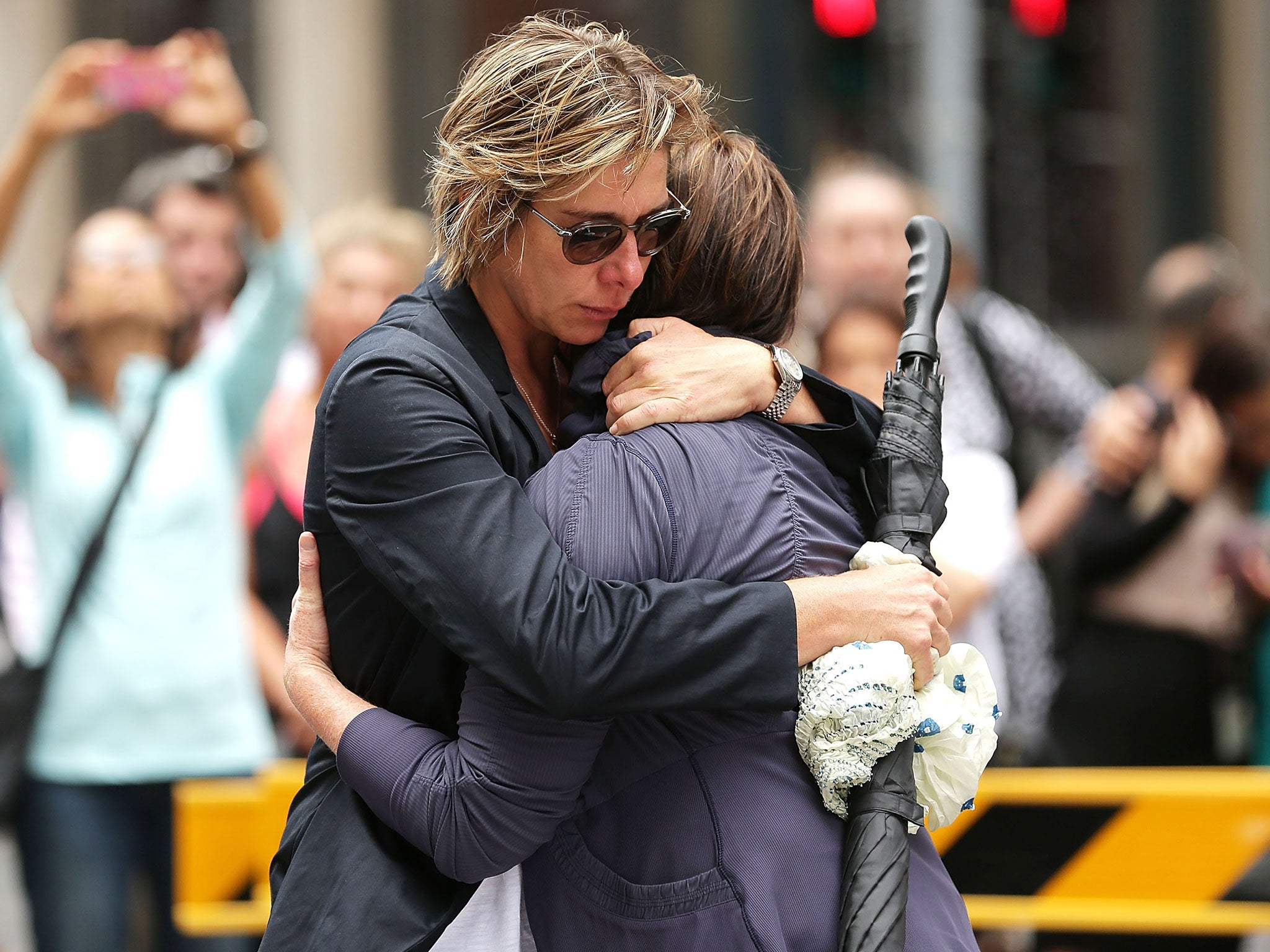 Women embrace in Martin Place in Sydney