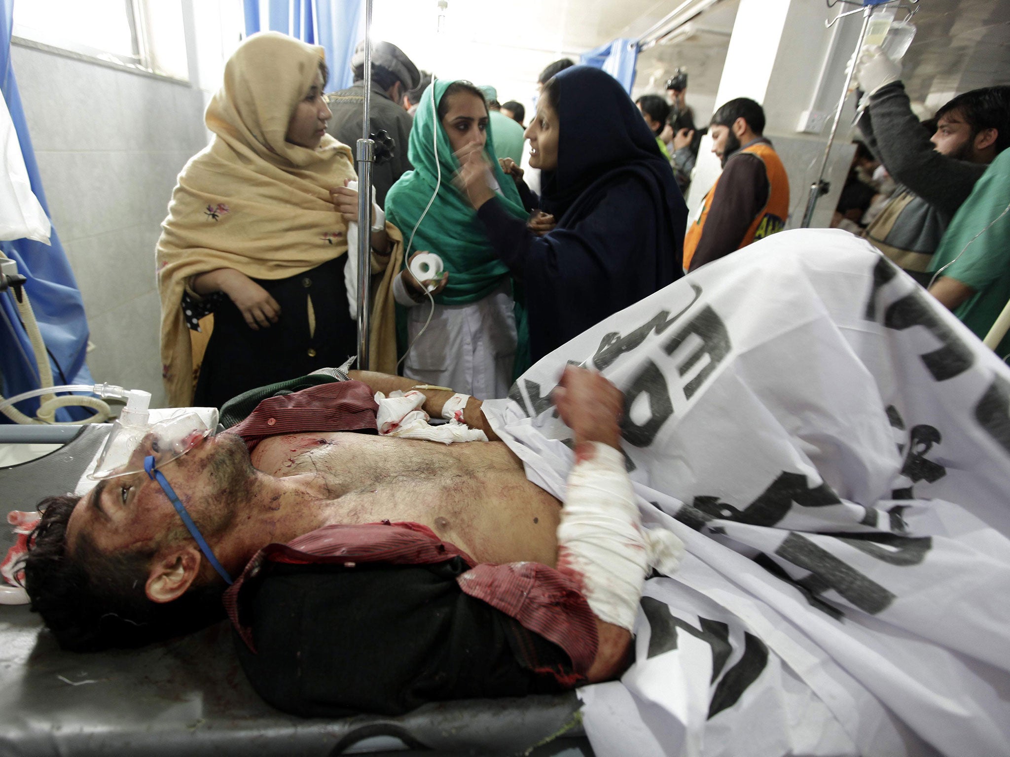 A school boy who was injured in a Taliban attack receives medical treatment at a hospital in Peshawar