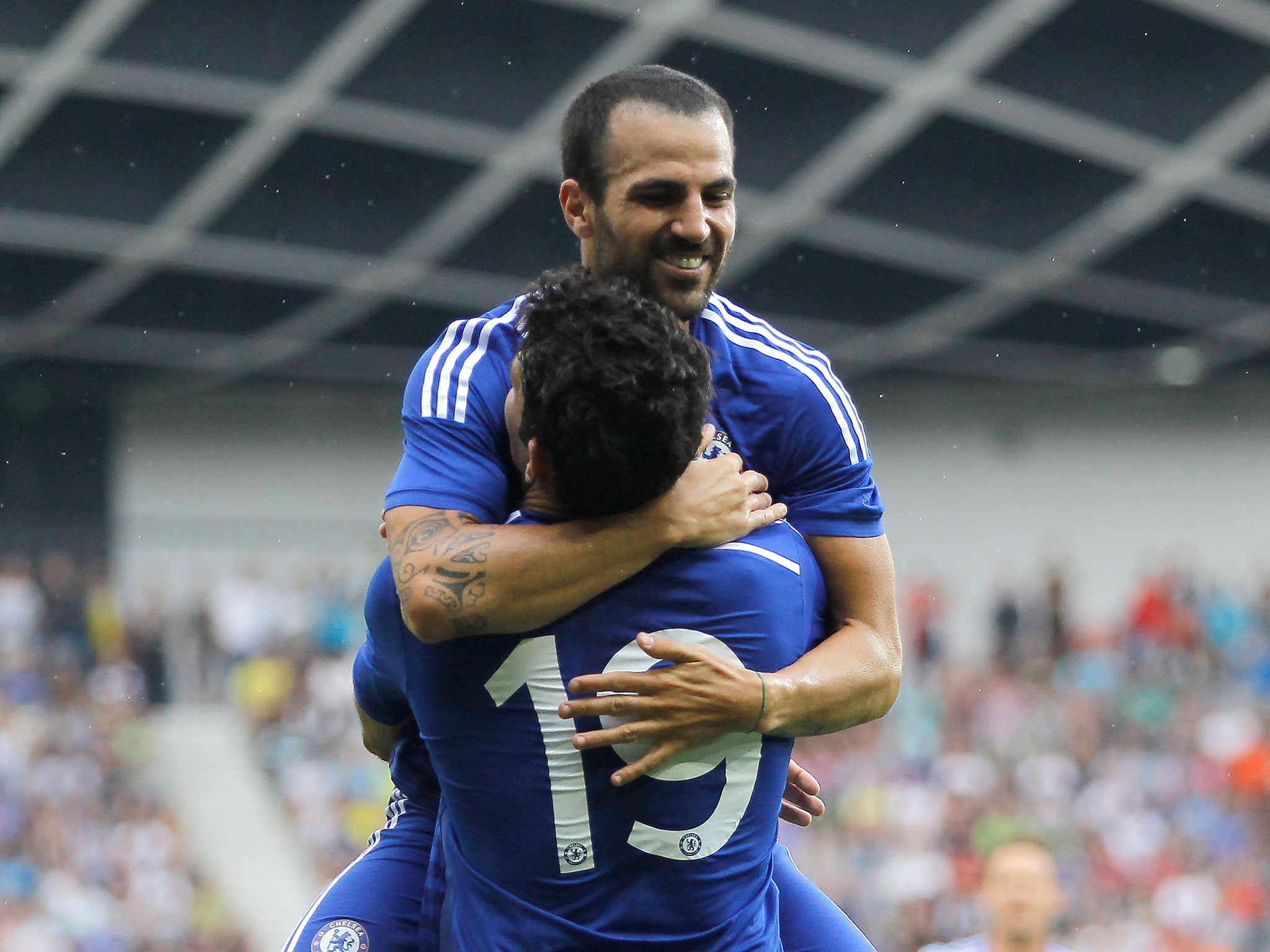 Cesc Fabregas celebrates with Diego Costa