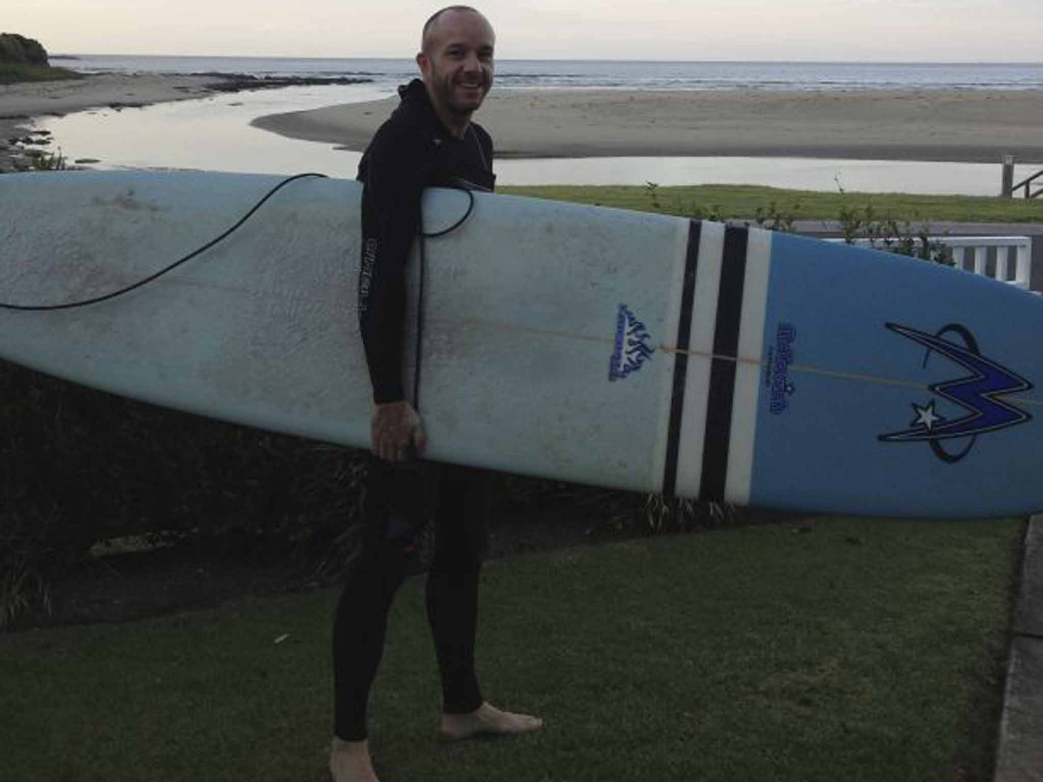 Surf's up: Matt Richell preparing to hit the waves - the pastime that would ultimately end his lifelong friendship with writer Saul Wordsworth