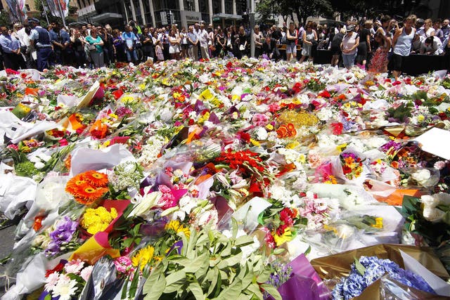 Floral tributes were placed near the café in central Sydney