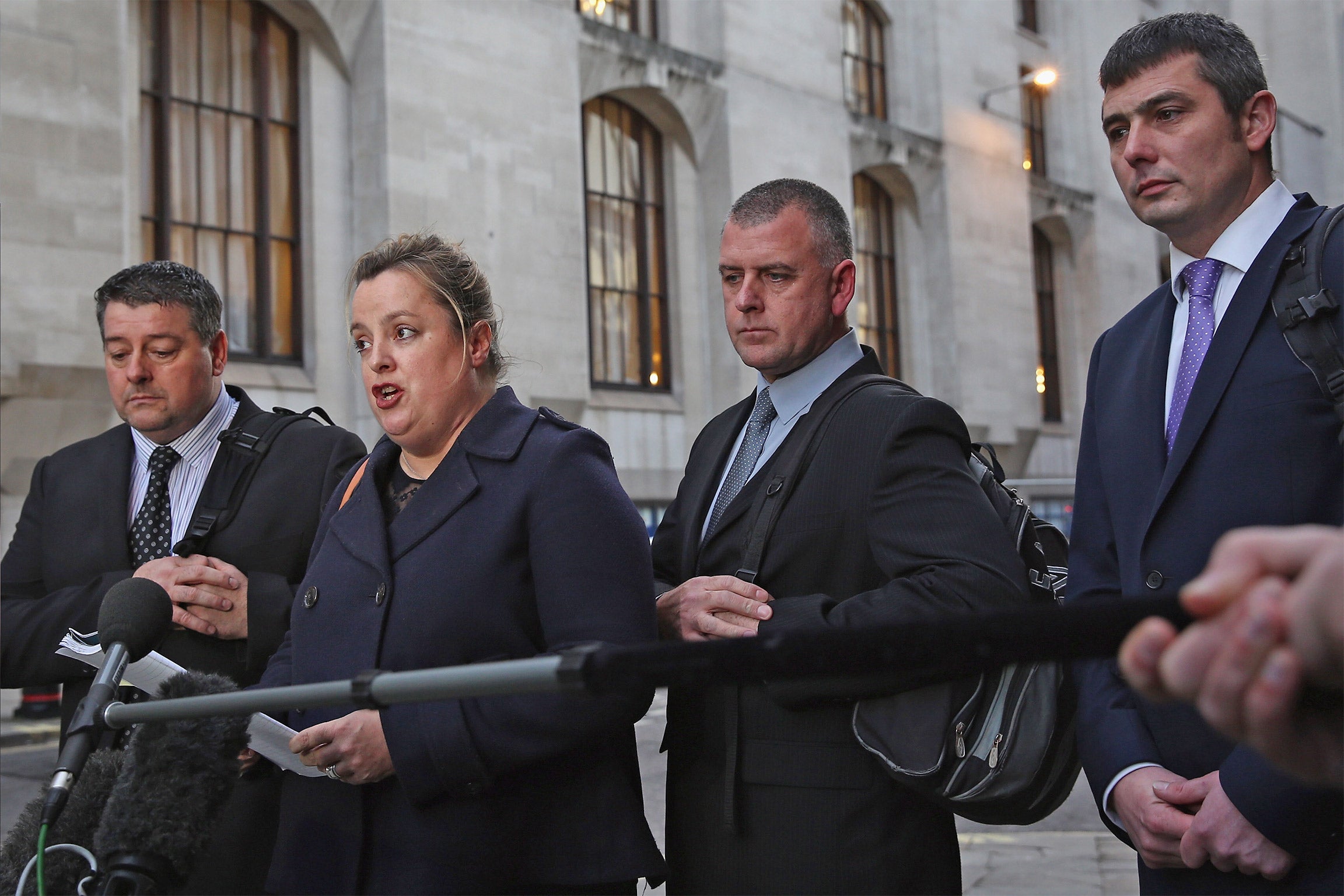 Terrence Hughes (left), Colin Kaler and Stuart Tribelnig (right) outside the Old Bailey; they denied using a technique known as carpet karaoke or hearing Mr Mubenga say he couldn’t breathe (Getty)