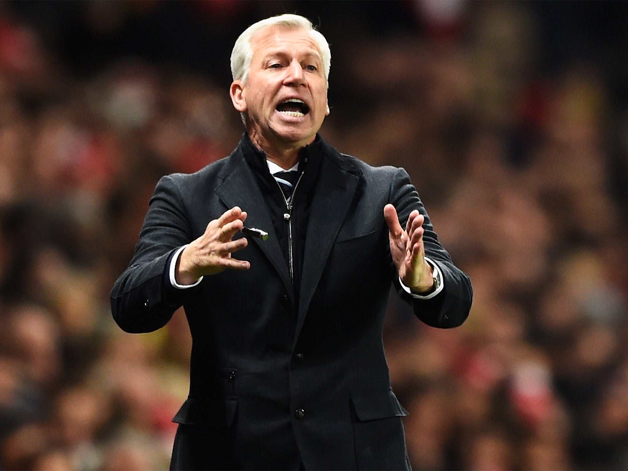 Alan Pardew reacts on the touchline