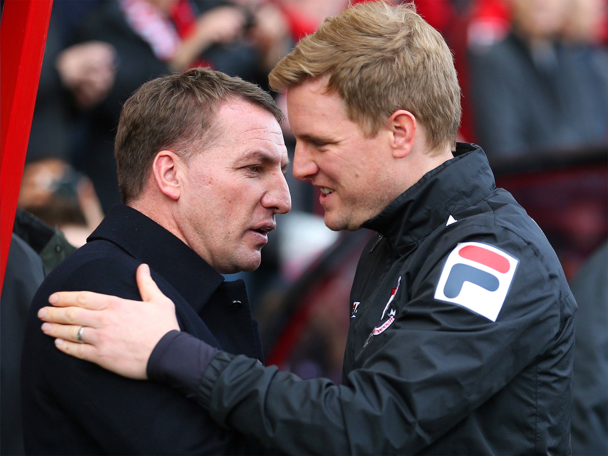 Eddie Howe (right) and Brendan Rodgers greet each other in the FA Cup last year