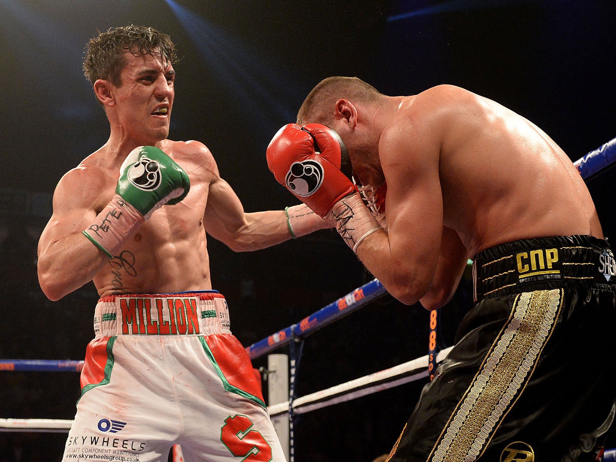 Anthony Crolla (left) in action against John Murray as Crolla is in hospital after confronting burglars