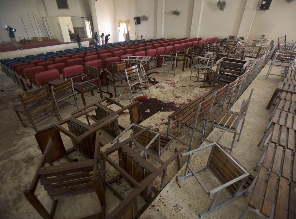 Chairs are upturned and blood stains the floor at the Army Public School auditorium the day after Taliban gunmen stormed the school in Peshawar, Pakistan