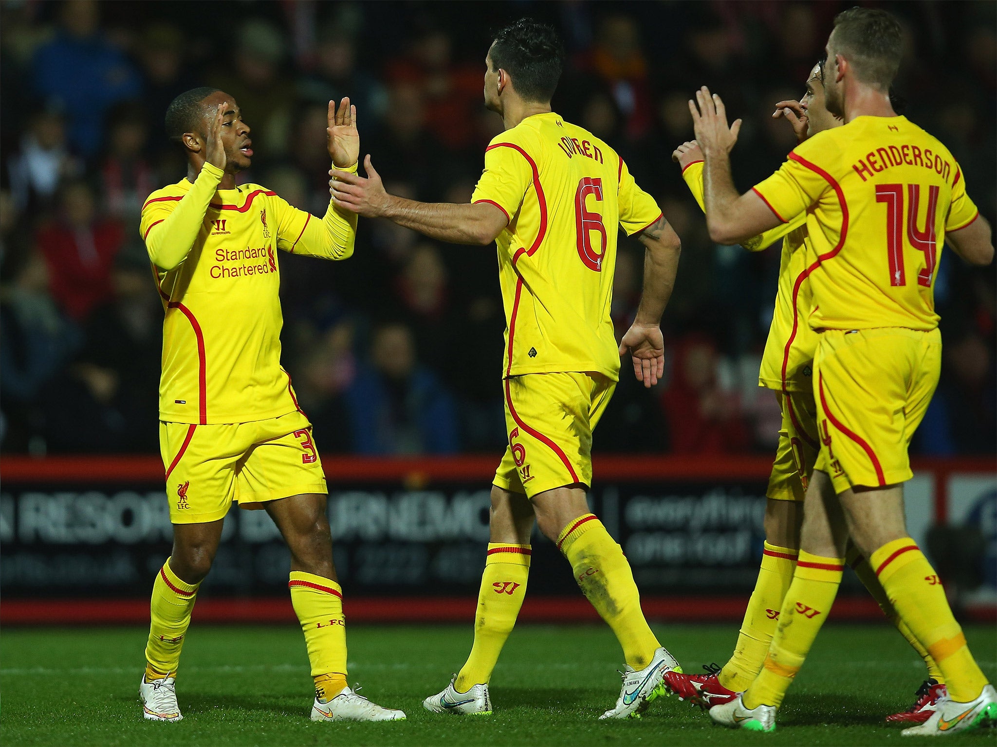 Raheem Sterling of Liverpool celebrates scoring the opening goal
