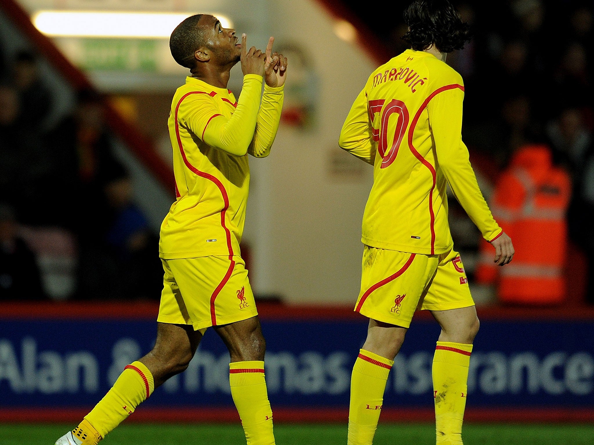 Sterling celebrates his opening goal for Liverpool