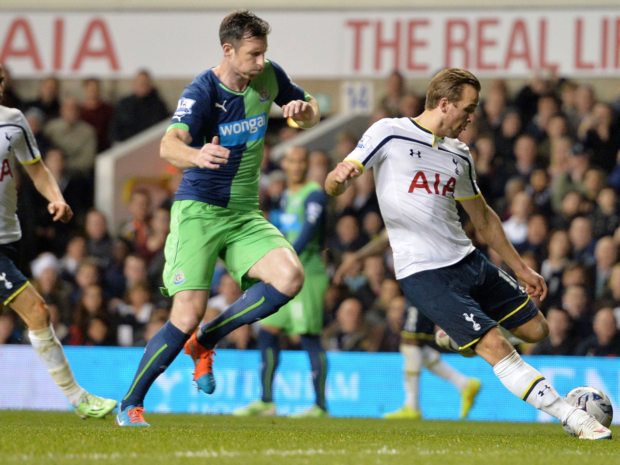 Spurs' striker Harry Kane scores their third goal