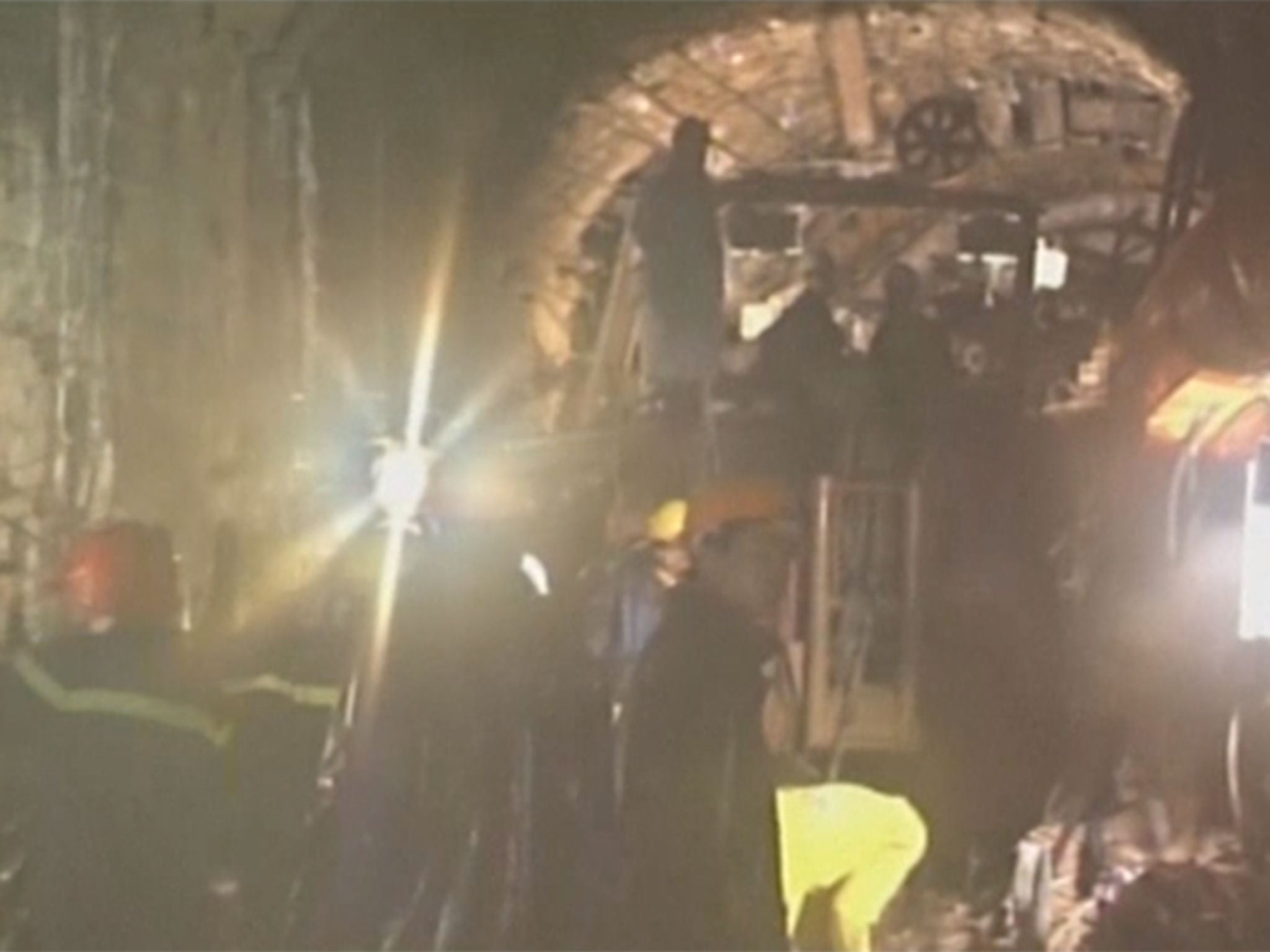 Rescuers in Vietnam have managed to drill a hole through a collapsed tunnel to communicate with 12 trapped workers on Wednesday.