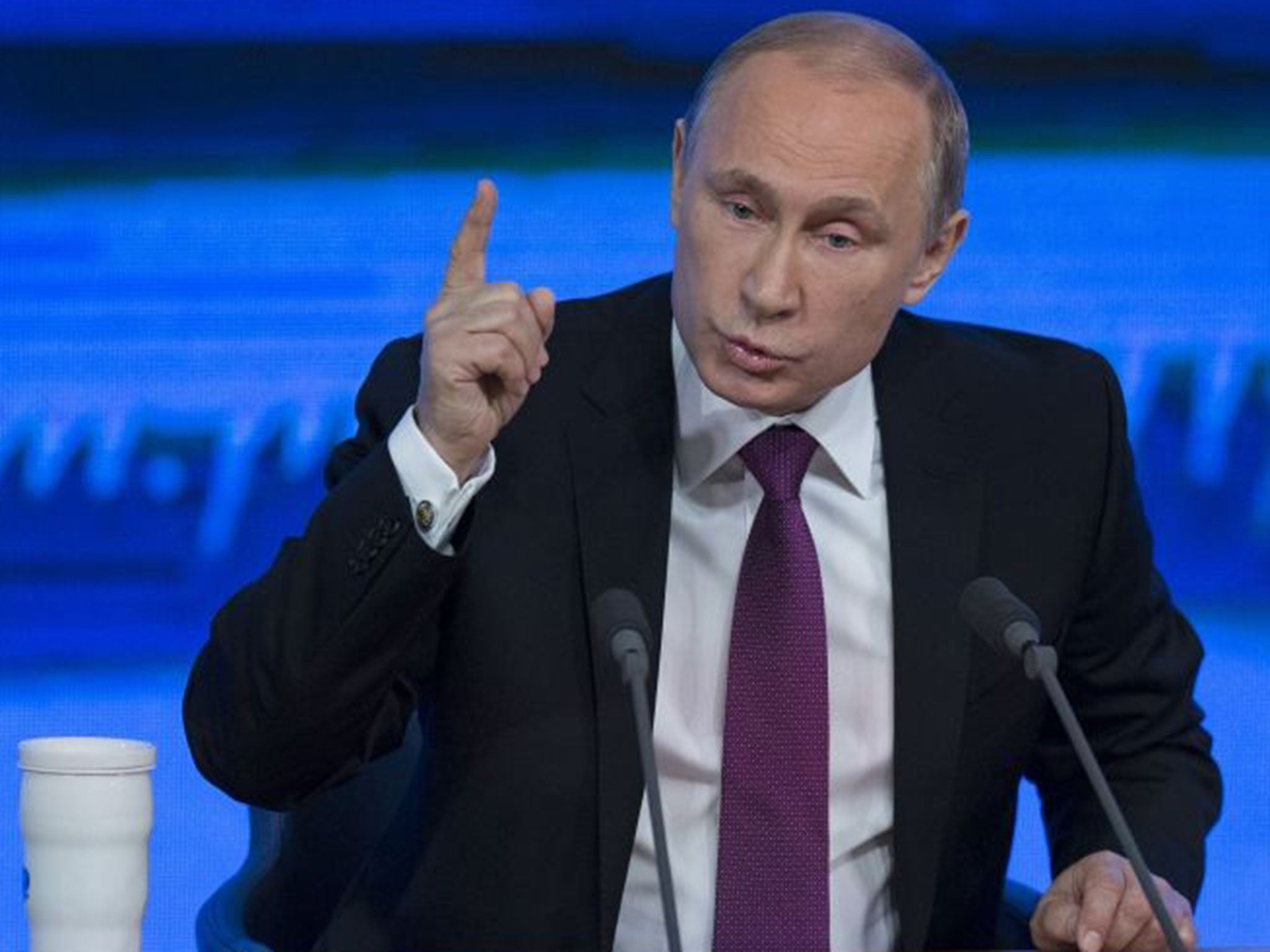 Russian President Vladimir Putin gestures during his annual news conference in Moscow, Russia, Thursday, Dec. 18, 2014