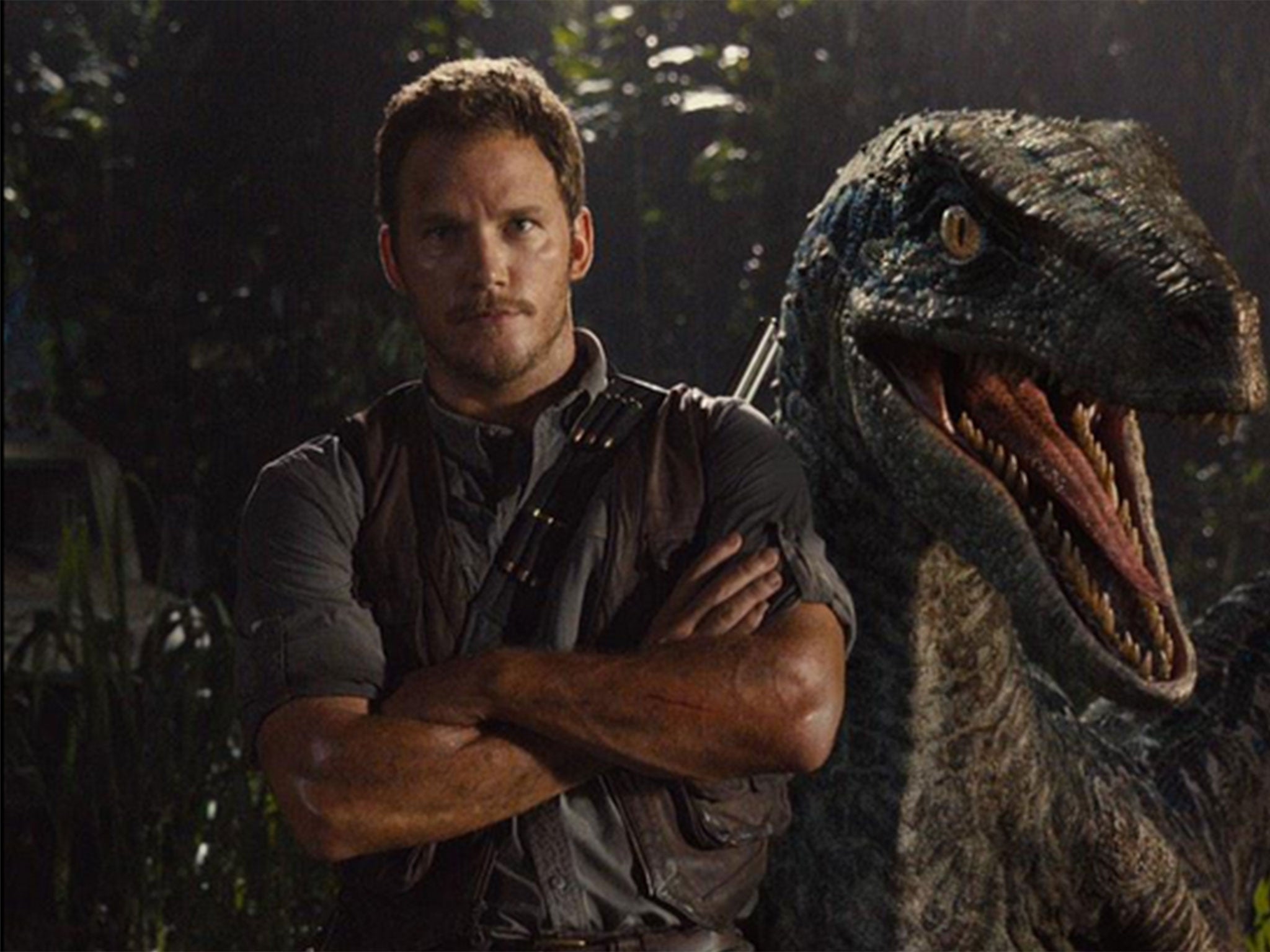 Chris Pratt with a raptor in a new Jurassic World promo shot