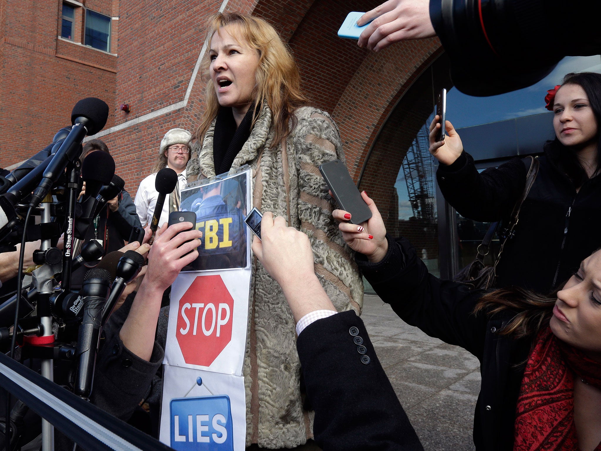 Elena Teyer speaks outside Boston federal court in support of Boston Marathon bombing suspect Dzhokhar Tsarnaev, after a final hearing before his trial begins in January