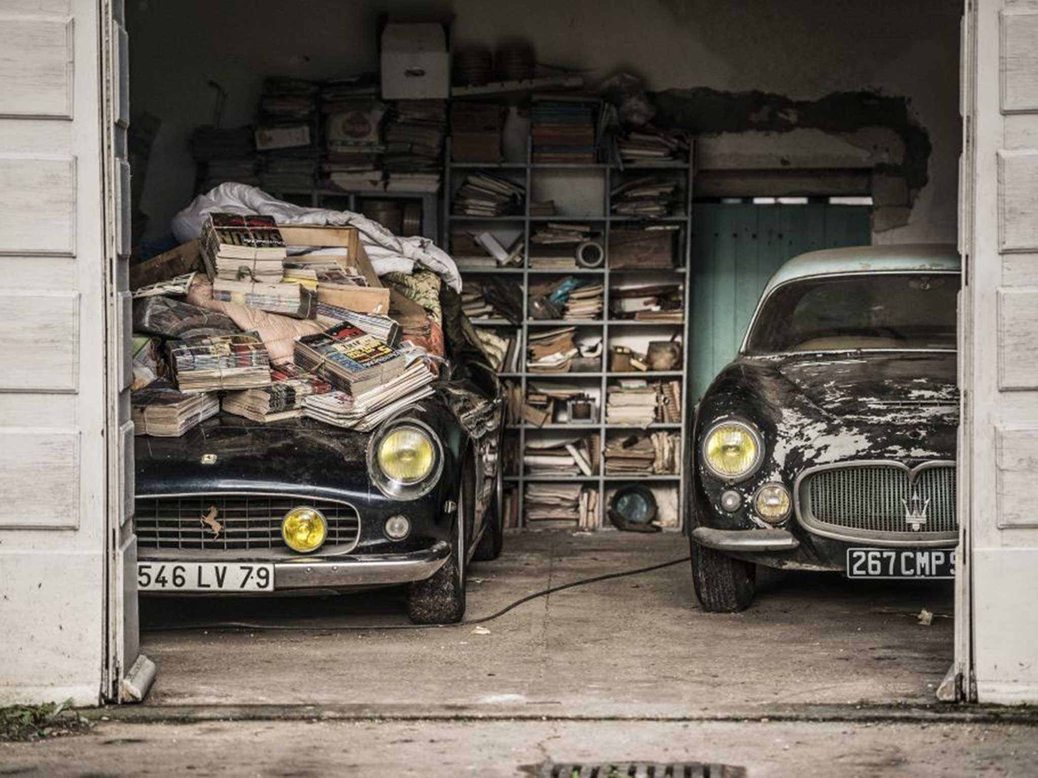 The 1961 Ferrari 250 GT SWB California Spyder (left) owned by Alain Delon as it was discovered in a remote farm in western France