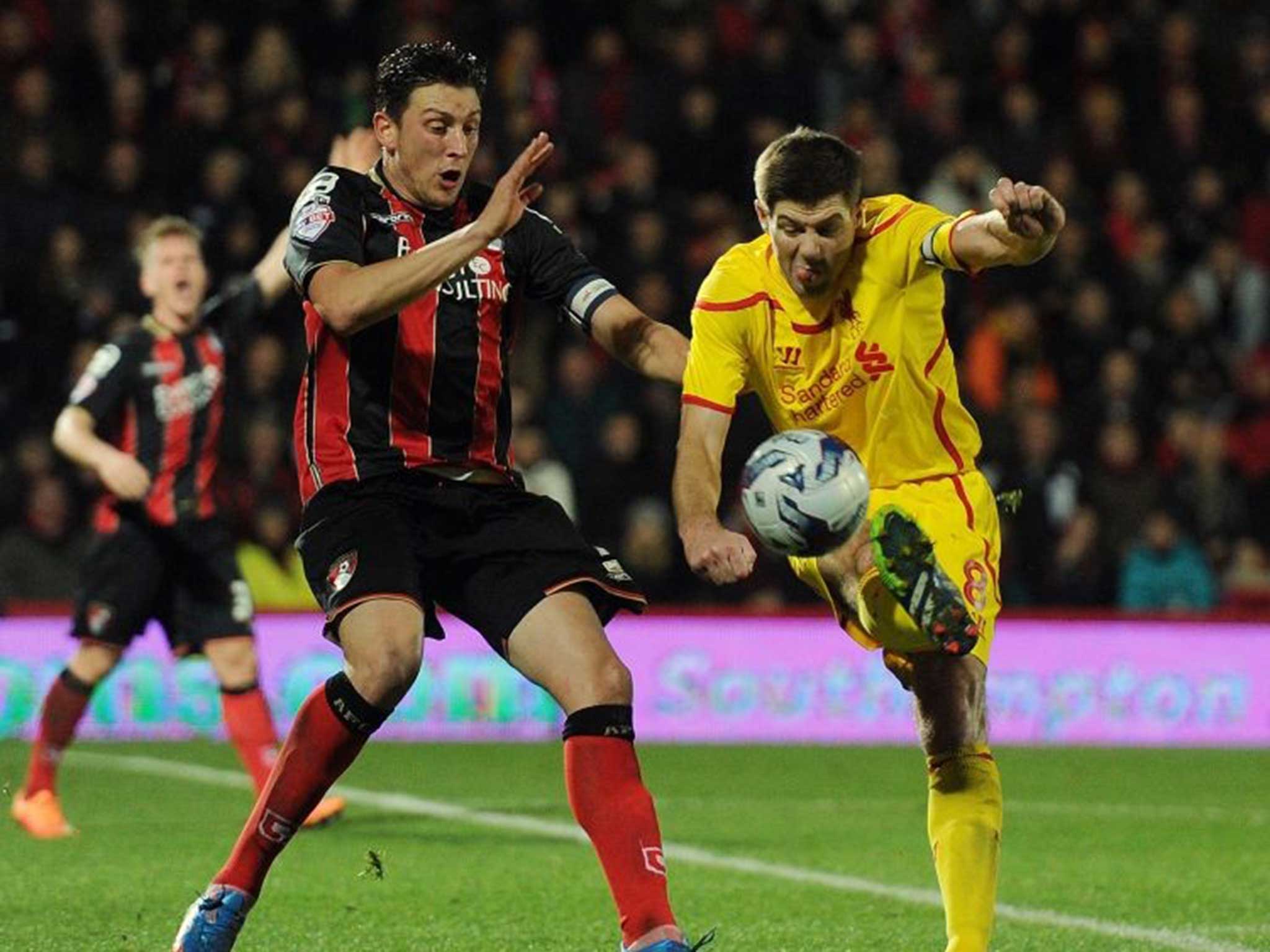 Steven Gerrard fights for the ball during Liverpool’s victory over Bournemouth on Wednesday