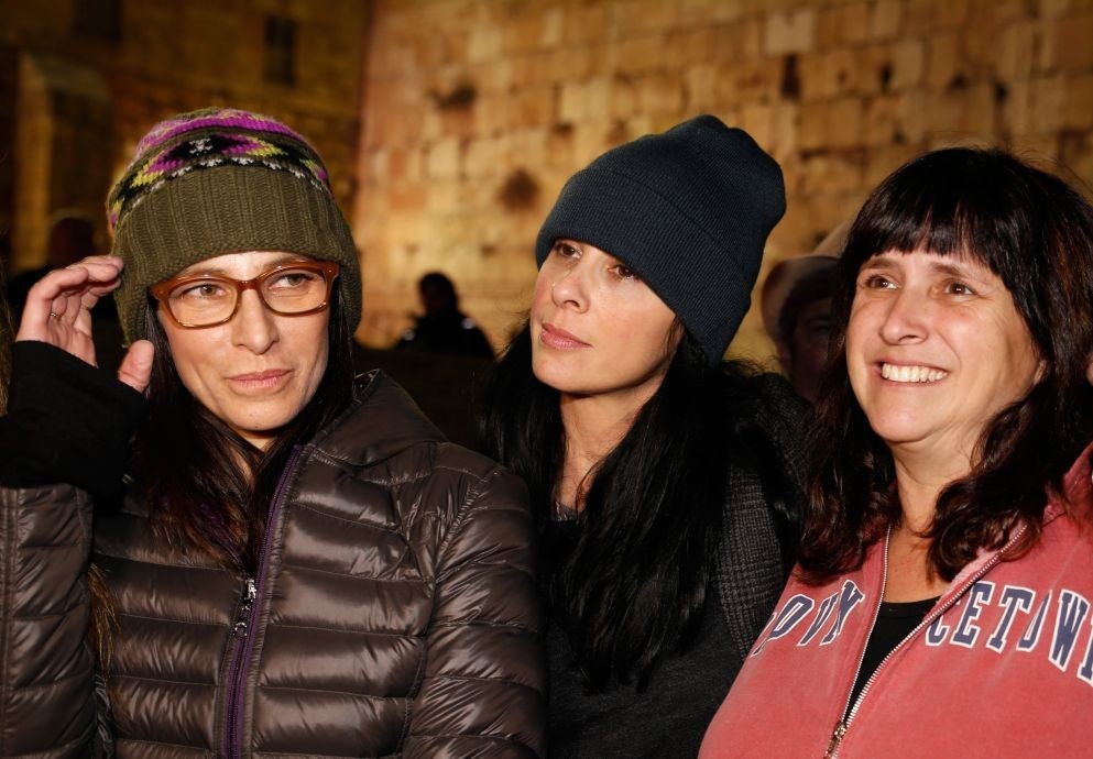 Sarah Silverman (middle) with sister Reform Rabbi Susan Silverman (right) and sister actress Laura Silverman (left) at Jerusalem's Western Wall for feminist Hanuka candle-lighting ceremony